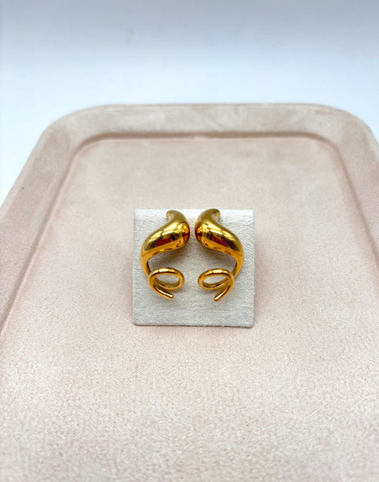 Boucles d'oreilles asymétriques dorées tire bouchon