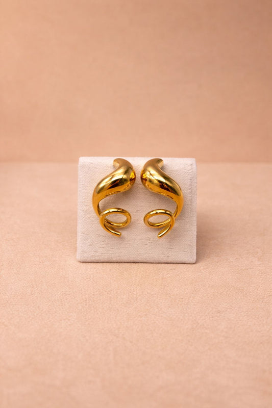 Boucles d'oreilles asymétriques dorées tire bouchon