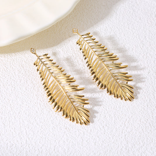 Boucles d'oreilles dorées feuille longue