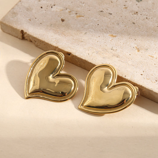 Boucles d'oreilles dorées cœur bombé effet miroir