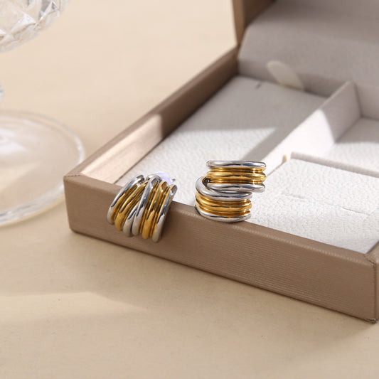 Boucles d’oreilles bicolores doré et argenté anneaux larges entrelacés effet miroir