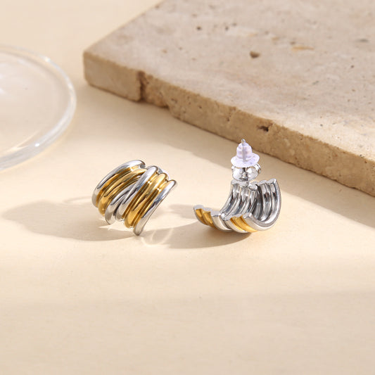 Boucles d’oreilles bicolores doré et argenté anneaux larges entrelacés effet miroir