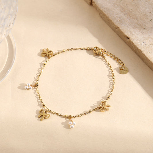 Bracelet délicat à nœuds pavés ajourés et perles fines