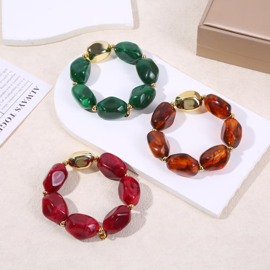 Bracelet élastique doré résine marron translucide marbrée formes arrondies