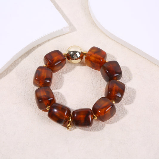 Bracelet élastique doré résine marron translucide marbrée formes carrés