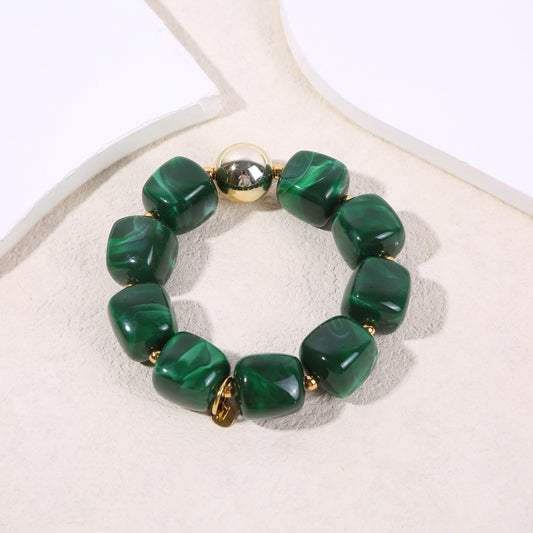 Bracelet élastique doré résine verte marbrée formes carrés