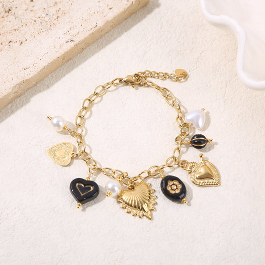 Bracelet chaîne dorée charms cœurs et résine noir