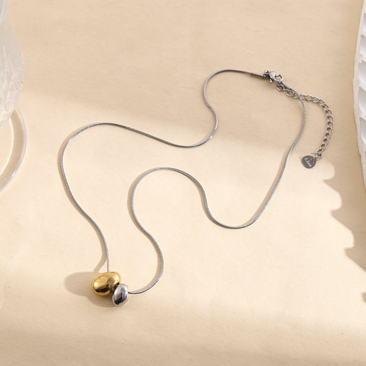 Collier chaîne argentée serpent pendentif bombé doré et argenté