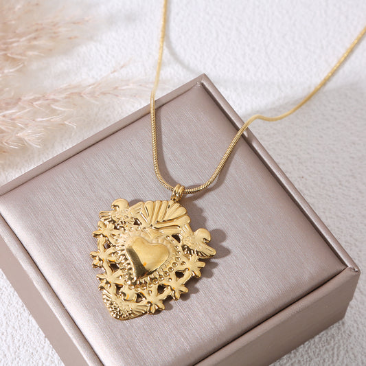 Collier sautoir chaîne dorée avec pendentif cœur ex-voto