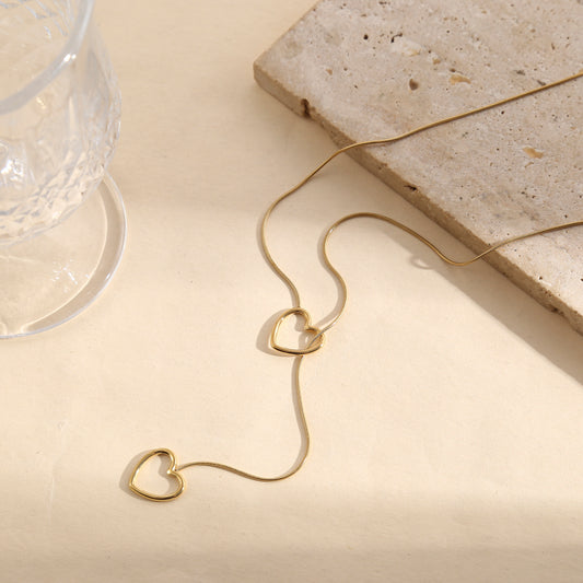 Collier doré chaîne fine serpent ronde double pendentif cœur ajouré entrelacé