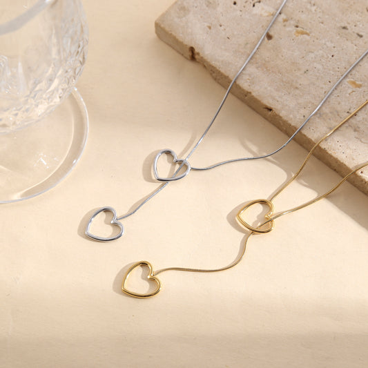 Collier doré chaîne fine serpent ronde double pendentif cœur ajouré entrelacé