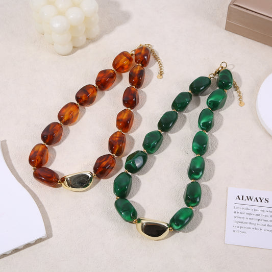 Collier doré résine marron translucide marbrée formes arrondies