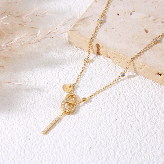 Collier doré chaîne fine sertie de strass fermoir toggle barre verticale strassée