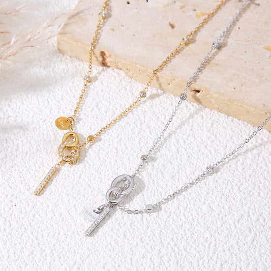 Collier doré chaîne fine sertie de strass fermoir toggle barre verticale strassée