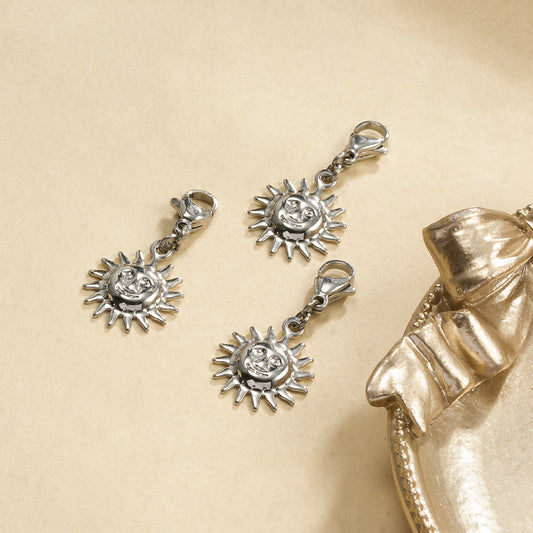 Lot de 3 pendentifs argentés soleil visage