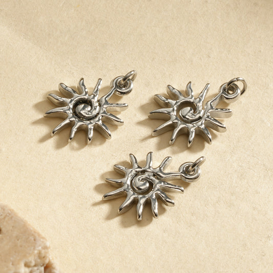 Lot de 3 pendentifs argentés soleil tourbillonant