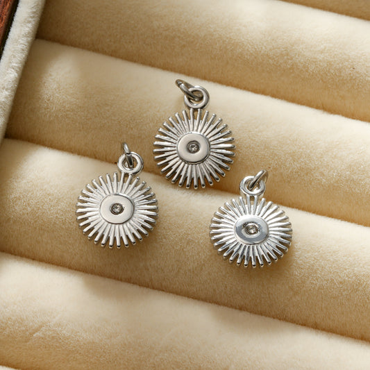 Lot de 3 pendentifs rond argentés motif rayons avec cristal central