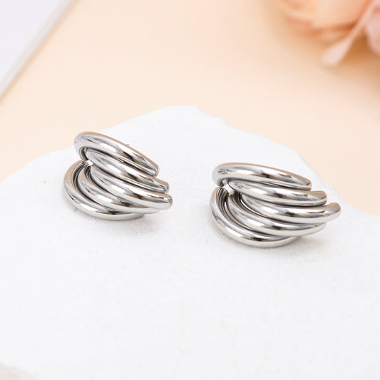 Boucles d’oreilles demi-anneaux entrelacés