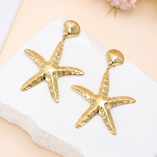 Boucles d’oreilles dorées coquillage et grand étoile de mer