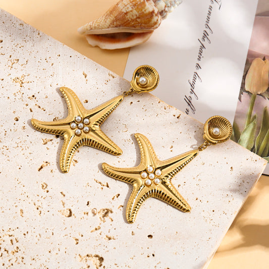 Boucles d'oreilles dorées pendantes étoile de mer et perles