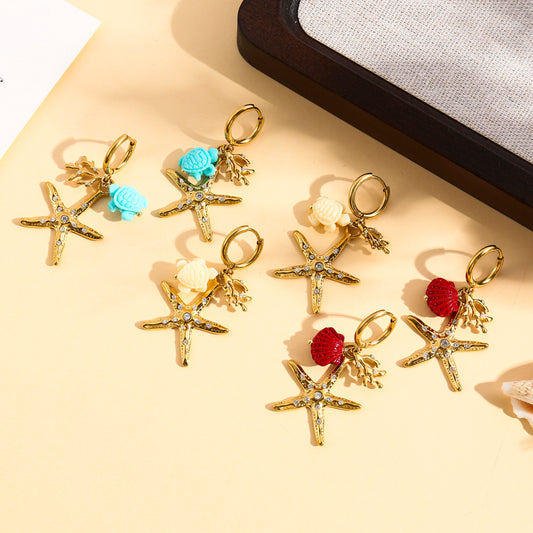 Boucles d’oreilles dorées créole étoile de mer strass et tortue