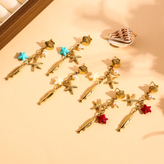 Boucles d’oreilles dorées pendantes poisson et étoile de mer