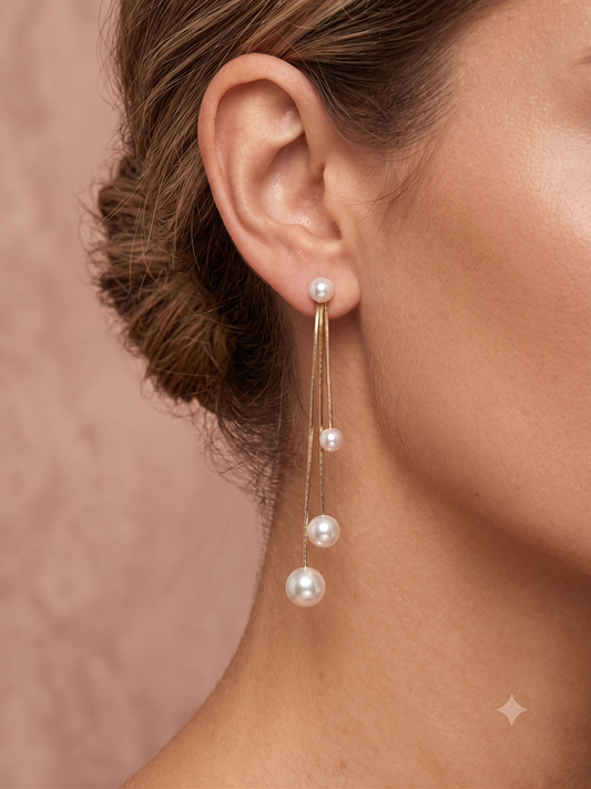Boucles d'oreilles dorées pendantes à perles