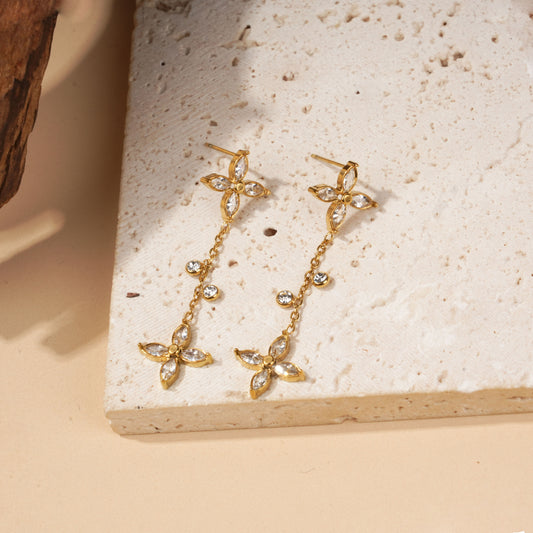 Boucles d'oreilles pendantes fleurs serties