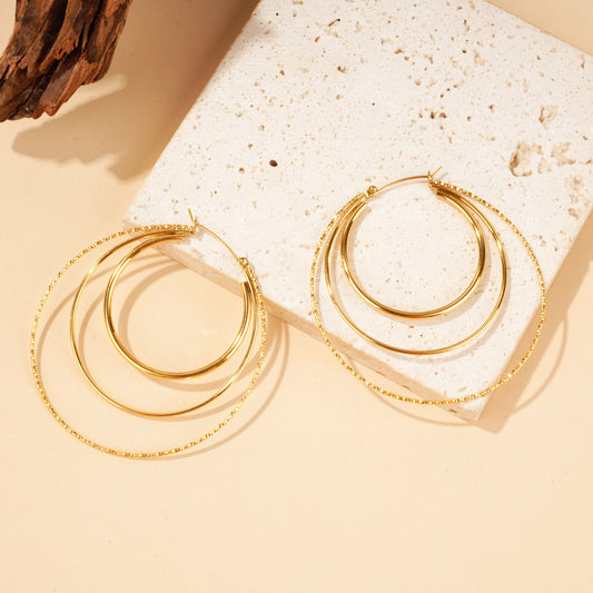 Boucles d'oreilles créoles multi anneaux dorées