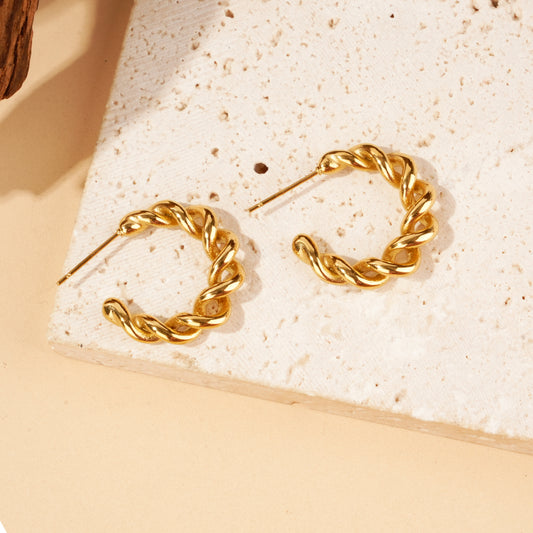 Boucles d'oreilles créoles dorées torsadées effet tressé