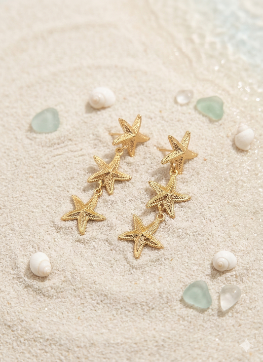 Boucles d’oreilles dorées pendantes trois étoiles de mer