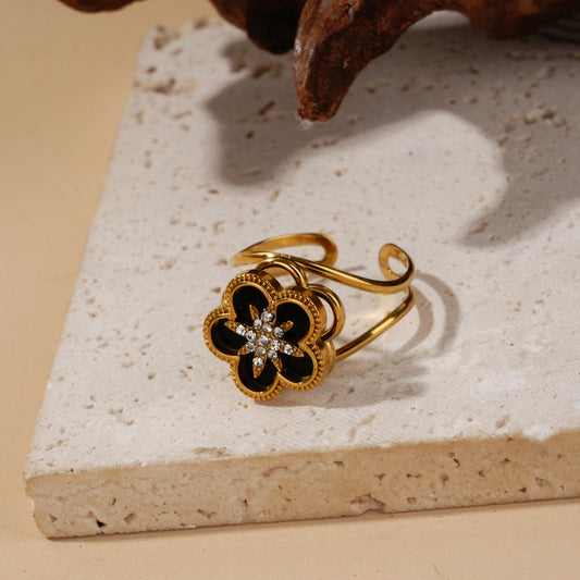 Bague anti-stress dorée à fleur noire rotative