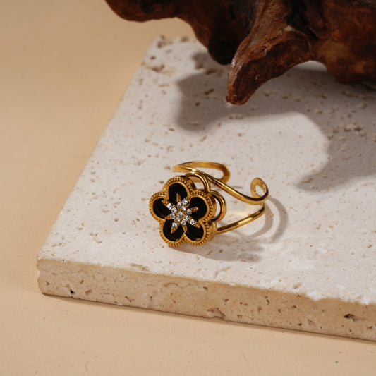 Bague anti-stress dorée à fleur noire rotative