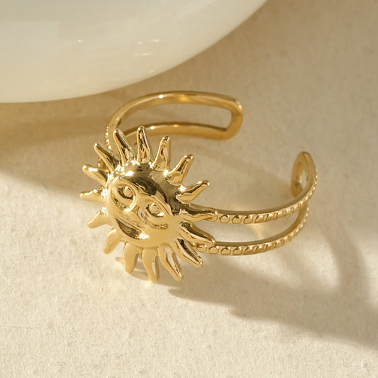Bague dorée ajustable deux anneaux avec soleil au visage