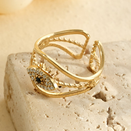 Bague dorée ajustable œil pavé de strass