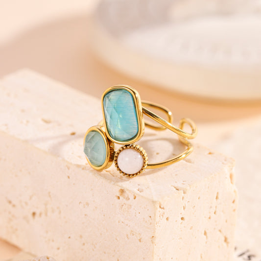 Bague dorée pierres turquoise et perle centrale