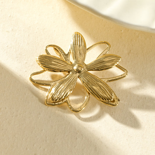 Broche dorée fleur pétales relief et contours ajourés