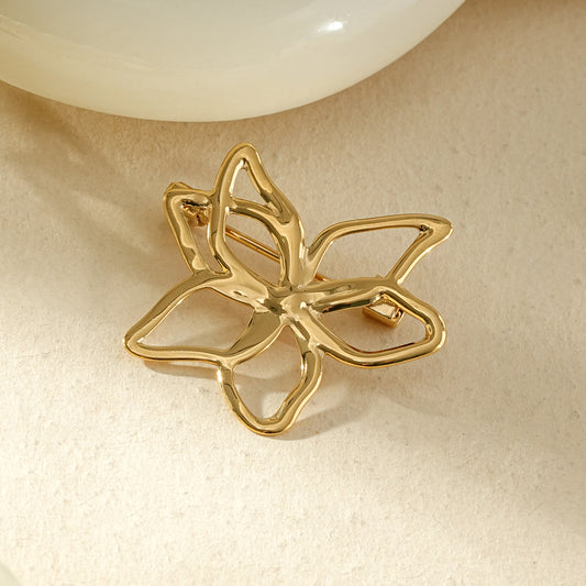 Broche dorée fleur ajourées avec traits abstraits