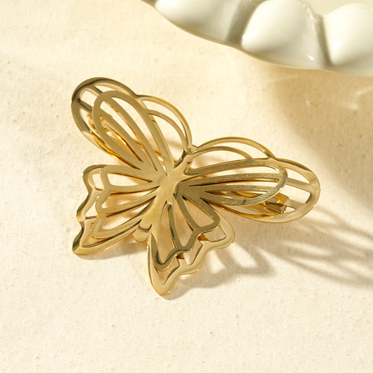 Broche dorée papillon aux lignes épurées
