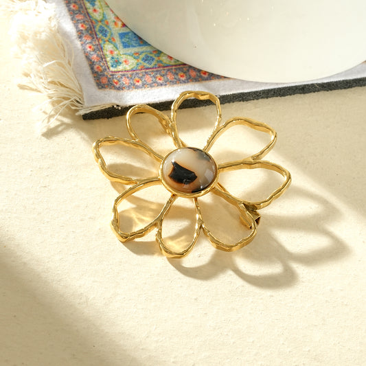 Broche fleur ajourée résine léopard