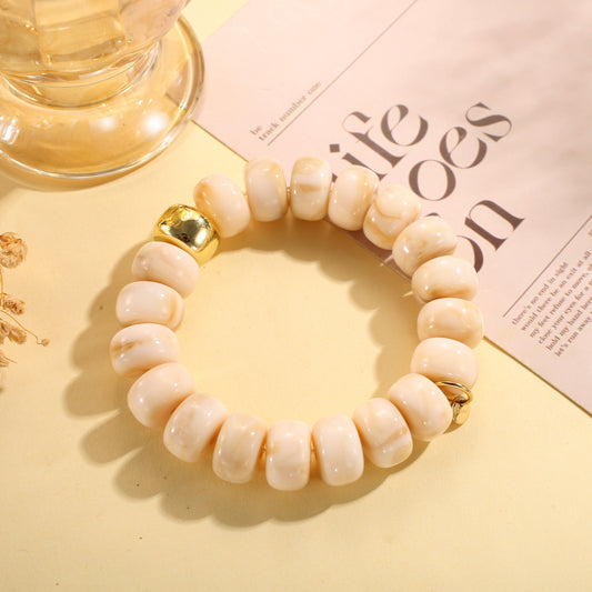 Bracelet élastique perles rondes en résine marbrée