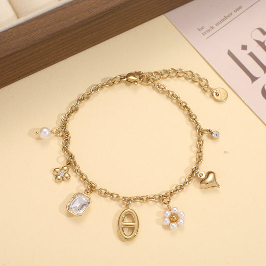 Bracelet doré breloques mixtes perle