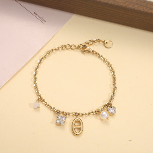 Bracelet chaîne breloques zircons perle