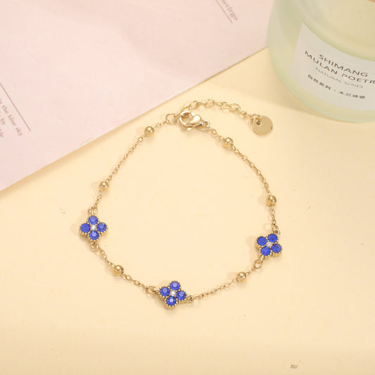 Bracelet chaîne dorée trèfles sertis
