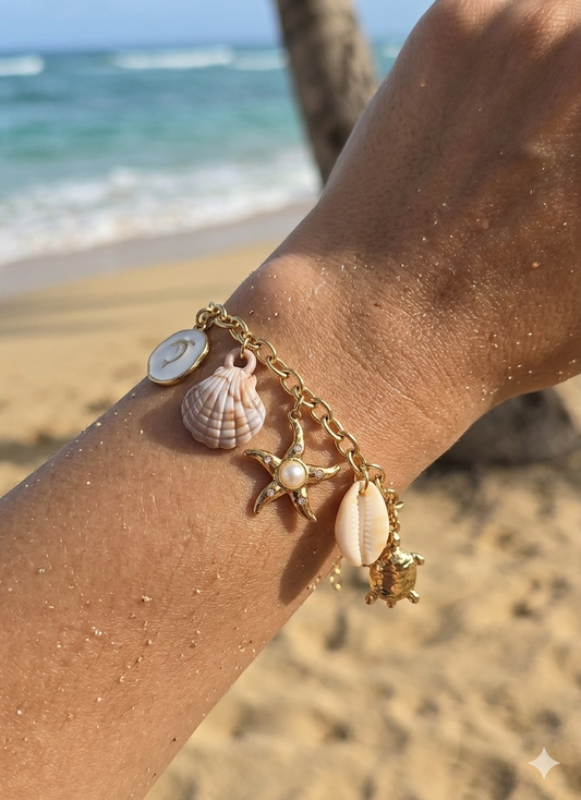 Bracelet doré charms marins étoile, coquillage et tortue
