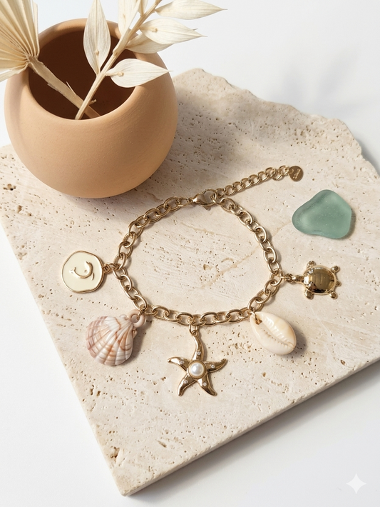 Bracelet doré charms marins étoile, coquillage et tortue