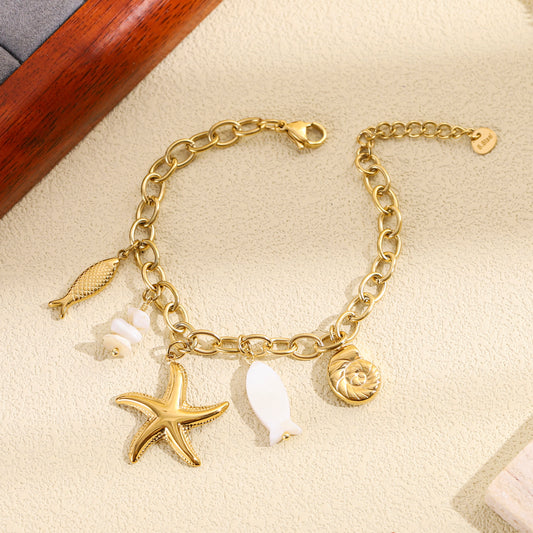 Bracelet doré charms marins étoile poisson coquillage