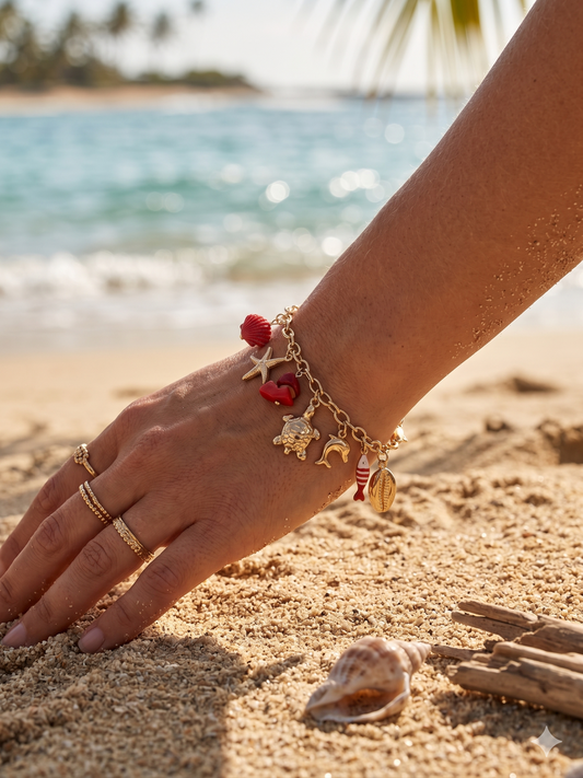 Bracelet doré à charms tortue marine et poisson