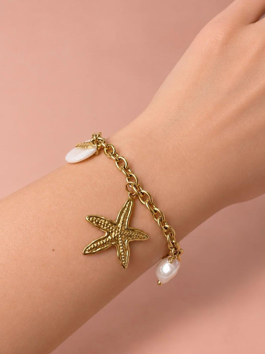 Bracelet doré charms étoile de mer, crabe et coquillage