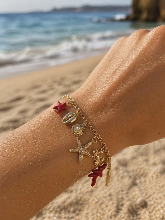 Bracelet doré charms marins, corail et étoile